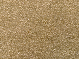 Rough light brown wall texture, suitable for background.

