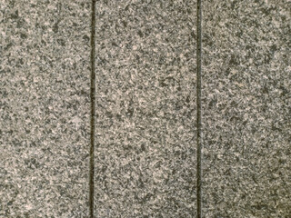 Cream ceramic tile wall texture with a square pattern.

