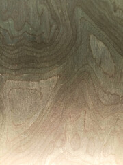Dark gray surface texture with slight color variations.

