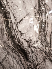 Marble texture with dark grey and white veins, giving a strong impression.

