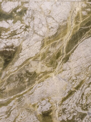 Green marble texture with white and gray veins, resembling natural patterns.

