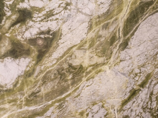 Green marble texture with white and gray veins, resembling natural patterns.


