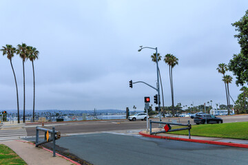 Light early morning traffic near wide open entrance gate to Maruta Gardner Playground from West...