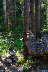 A pyramid of stones on a large boulder in the Ruskeala Mountain Park in Karelia