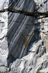 Bizarre patterns of marble on huge stones in old quarries in the Ruskeala Mountain Park in Karelia