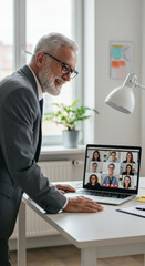 Senior adult having a video call on the laptop. Senior adult having a business meeting