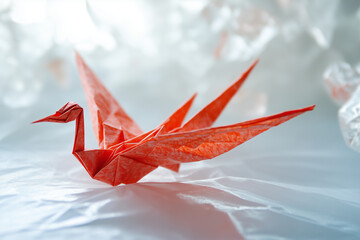 Red Origami Paper Crane on White Background – Traditional Japanese Art, Minimal Handmade Bird Figure, Peace and Zen Concept