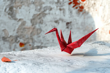 Red Origami Paper Crane on White Background – Traditional Japanese Art, Minimal Handmade Bird Figure, Peace and Zen Concept