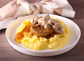 Roast veal tenderloin with gravy and mushroom sauce