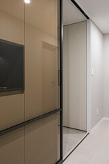 The front door is installed with a black frame, creating a chic interior