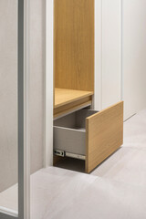 The front porch stool that can be used as a folding chair opens to reveal a drawer