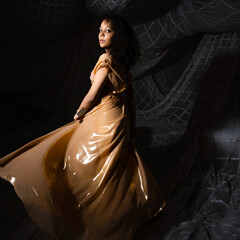 Exquisite Arabic-style dress with golden embroidery, beautiful woman in costume party.