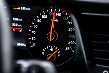 Car screen dashboard with hundred thirty km on speedometer indicator.Intelligent driver digital information panel system in modern luxury automobile.Safe driving concept.