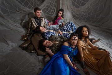 Oriental fantasy scene with Turkish-style dressed models in elaborate costumes, storybook...