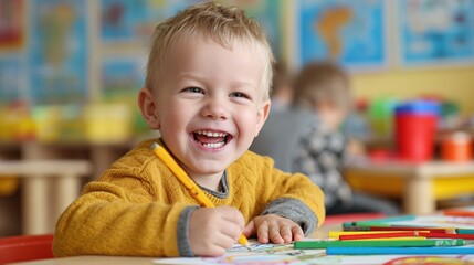 Joyful young child drawing with colorful pencils, radiating happiness and creativity in a bright classroom. Early learning at its finest.