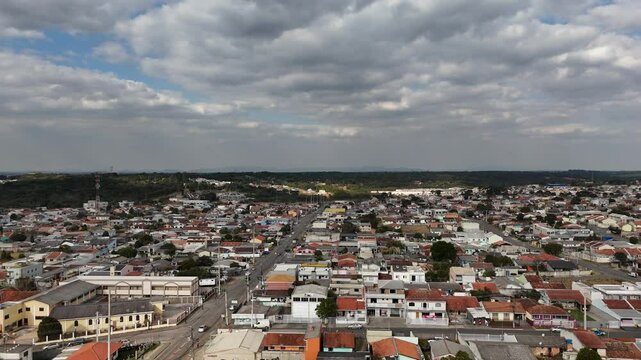 Aerial video of urban life in Fazenda Rio Grande, Paran&aacute;, Brazil, showing traffic, buildings, and everyday city movement from a high angle perspective.