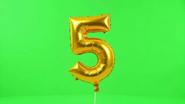 Golden five balloon floats against a vibrant green backdrop, celebrating anniversaries and milestone occasions