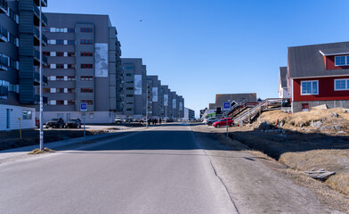 Seven apartment blocks with series of pictures of ravens to form a whole image on Taupannguit street in Nuuk
