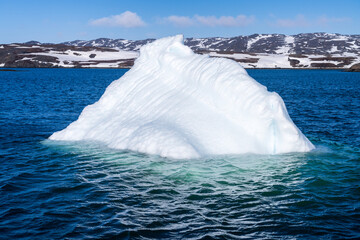 Iceberg seen on tour on fjord near the capital city of Nuuk near Sermitsiaq mountain © steheap