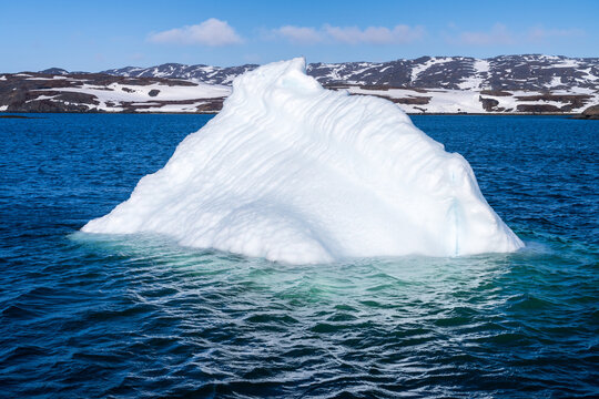 Iceberg seen on tour on fjord near the capital city of Nuuk near Sermitsiaq mountain - Powered by Adobe