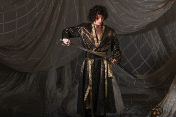 Elegant Arabic-inspired menswear with ornate eastern patterns for themed costume event.