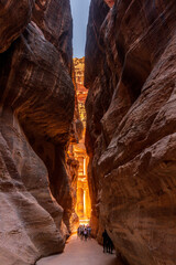 The carved facade of the Treasury building or Al-Khazneh in the ancient city of Petra in Jordan...