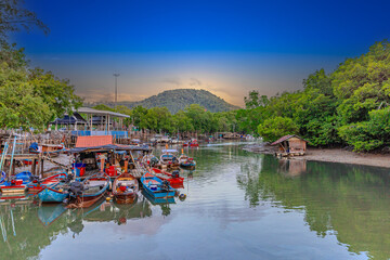 Obraz premium Beautiful view from Kao Khad next to Cape Panwa on the island of Phuket Thailand. Views of the turquoise Blue waters of the Andaman Sea and small islands off the coat of Phuket