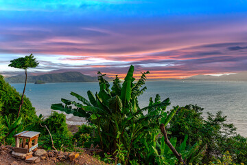 Beautiful view from Kao Khad next to Cape Panwa on the island of Phuket Thailand. Views of the turquoise Blue waters of the Andaman Sea and small islands off the coat of Phuket