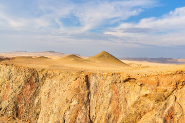 Desert dunes stretch across the arid landscape of Paracas National Reserve in Peru.