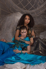 Oriental princess gathering - young women in elaborate Arabic costumes with rich decorative details