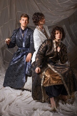 Mysterious oriental gentlemen in lavish Turkish costumes, atmospheric cultural photography