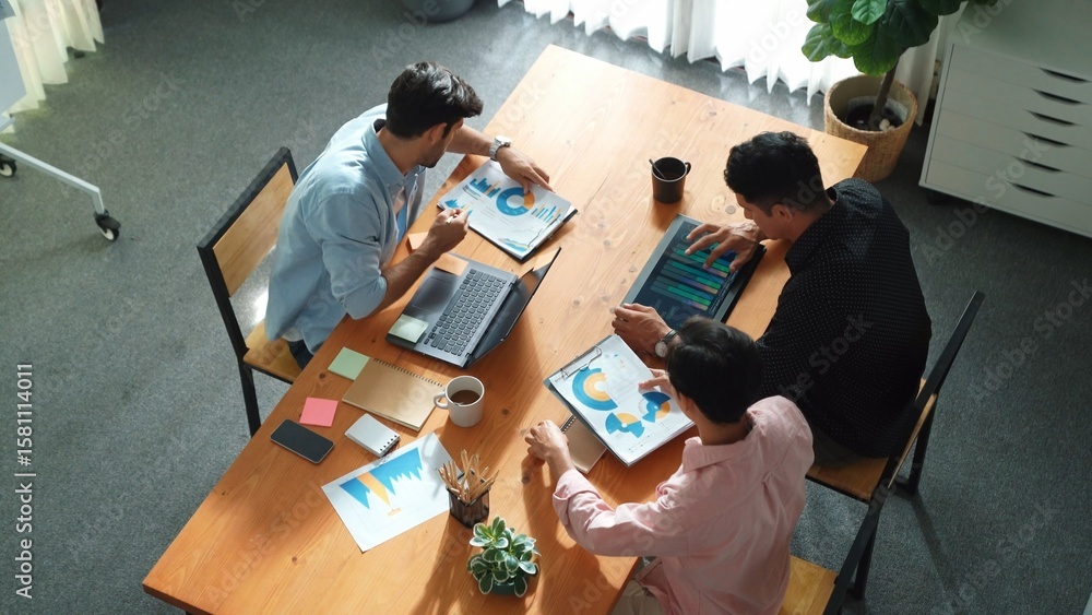 Aufkleber top view of diverse business team talking and brainstorming marketing idea while colleague walking a