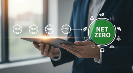 Person using tablet to track progress towards net zero emissions goals