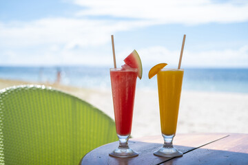Enjoy the vibrant colors of freshly squeezed mango and watermelon juices served against the serene backdrop of an endless ocean. The perfect blend of flavors in paradise