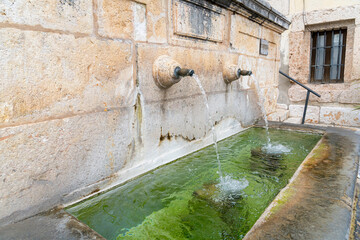 Historic fountain in Brihuega showcasing charming architecture and tranquil water features