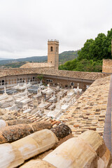 Exploring the historic cemetery and church tower in Brihuega, Guadalajara, Spain, surrounded by...