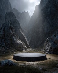 Dark gray circle podium amidst dramatic mountain valley