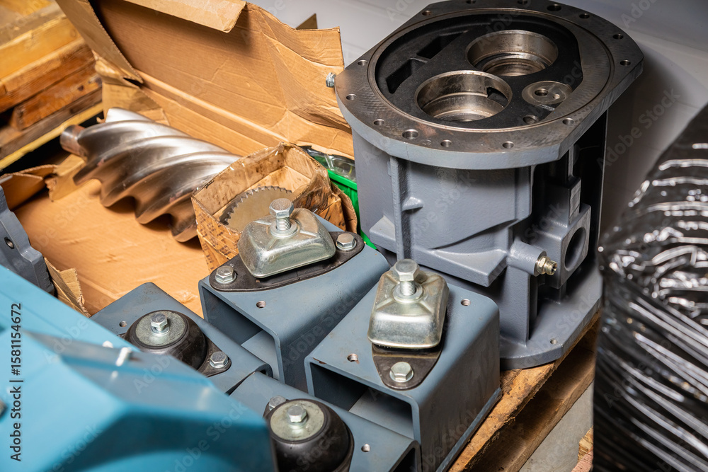 Poster new screw compressor block and rotor waiting for assembling in a cardboard box
