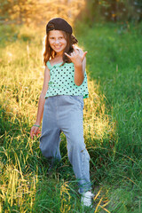 Portrait of attractive little girl smiling and looking at camera. Childhood leisure concept....