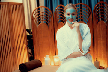 Serene ambiance of spa salon, woman customer indulges in rejuvenating with luxurious face cream...