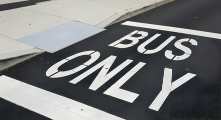 Clear bus lane marking on asphalt road surface, ensuring efficient public transportation