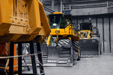 Mining industrial Bulldozer on service maintenance in garage, car truck fix
