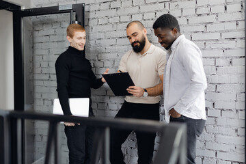 Multiracial Team Collaboration in a Modern Office Environment