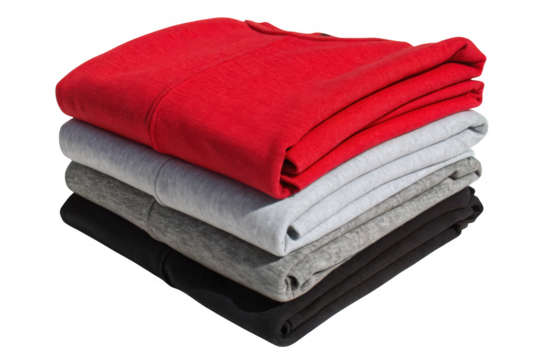 Stack of folded red grey and black t shirts apparel clothing items isolated on transparent background