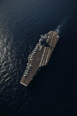 High-angle view of a naval aircraft carrier on the water.