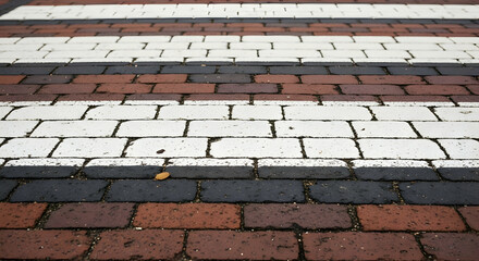 Detailed close-up of a colorful brick crosswalk with weathered textures pattern