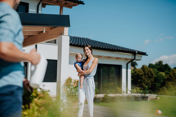 Joyful family moment in backyard with child