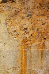 abstract background with rusty concrete texture in grunge style. rough rusty stone texture. vertical shot