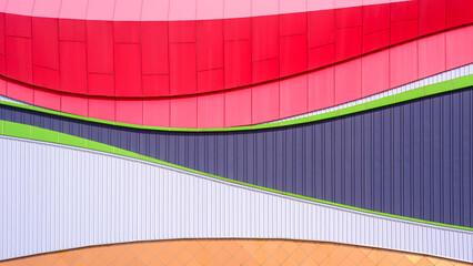 Modern geometric exterior building wall decoration background with colorful corrugated steel and aluminium composite tile abstract curve pattern in minimal design