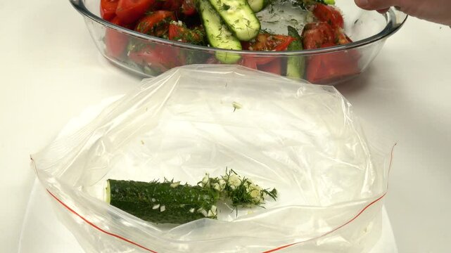 Vegetable salad is being placed in a plastic zipper storage bag for fast pickling and storage
